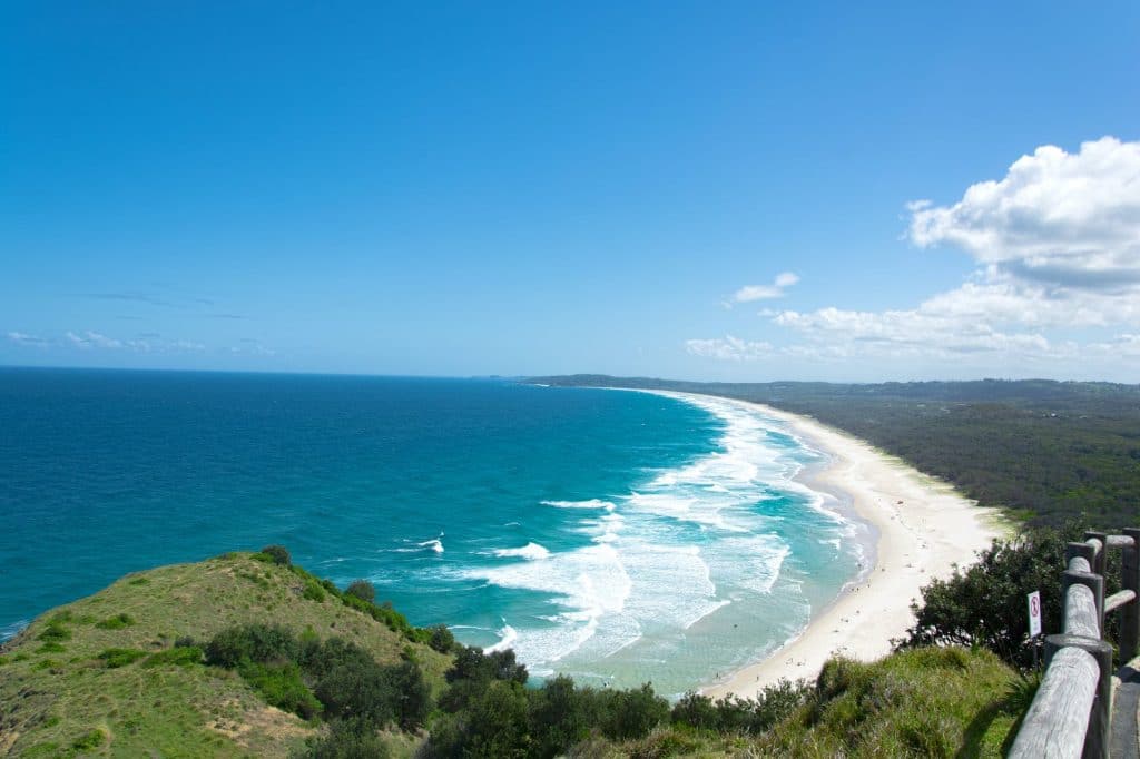 Walk barefoot in Byron Bay – catch the Aussie vibes.