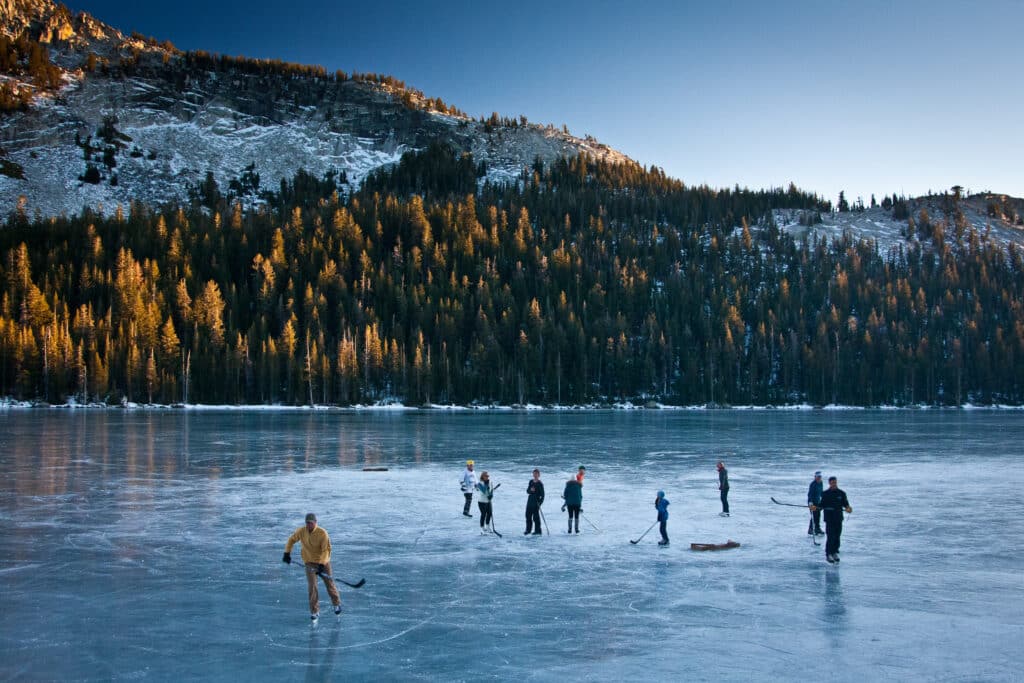 Ice skating on a frozen lake is a bucket list-must in Canada in winter.