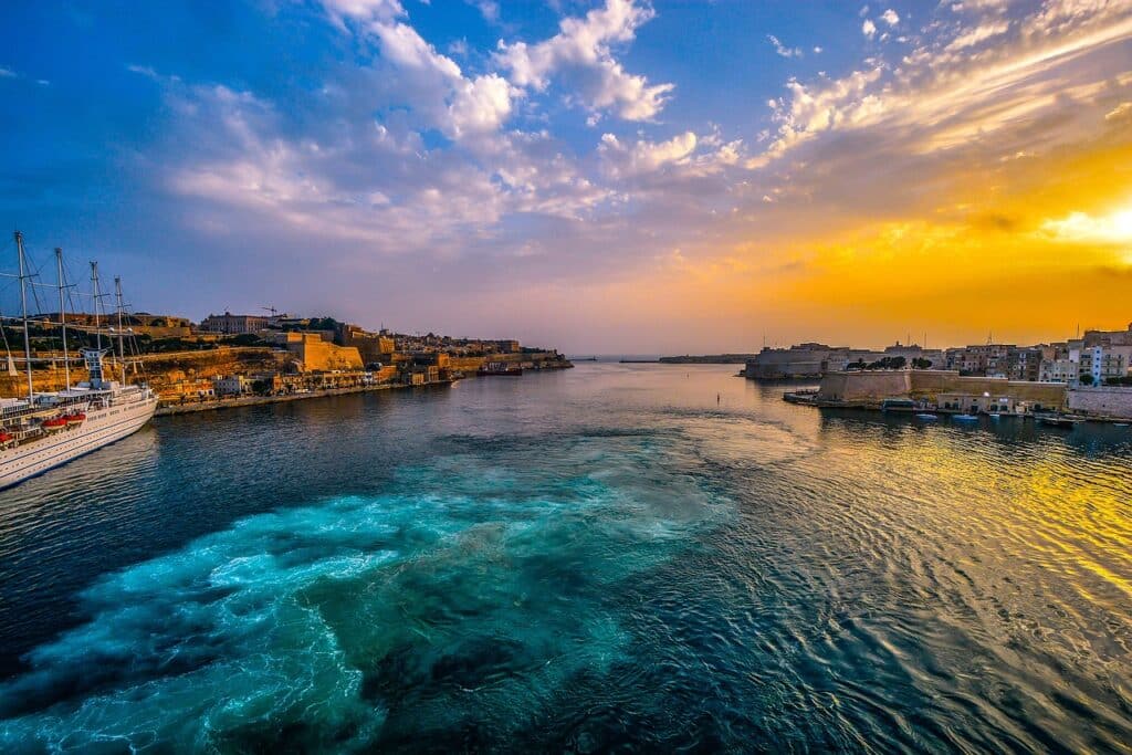 Malta is one of the warmest countries in Europe in February. This image depicts the sunset over the water in Malta.