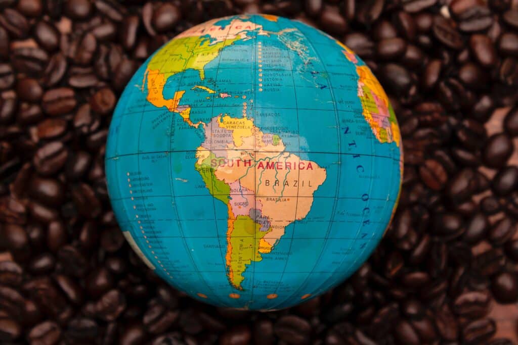 Coffee Beans around South America on Globe.