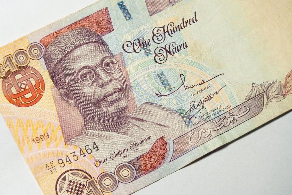 An old one hundred Naira banknote depicting Chief Obafemi Awolowo. Keeping cash on your person is one of our top Nigeria travel tips.
