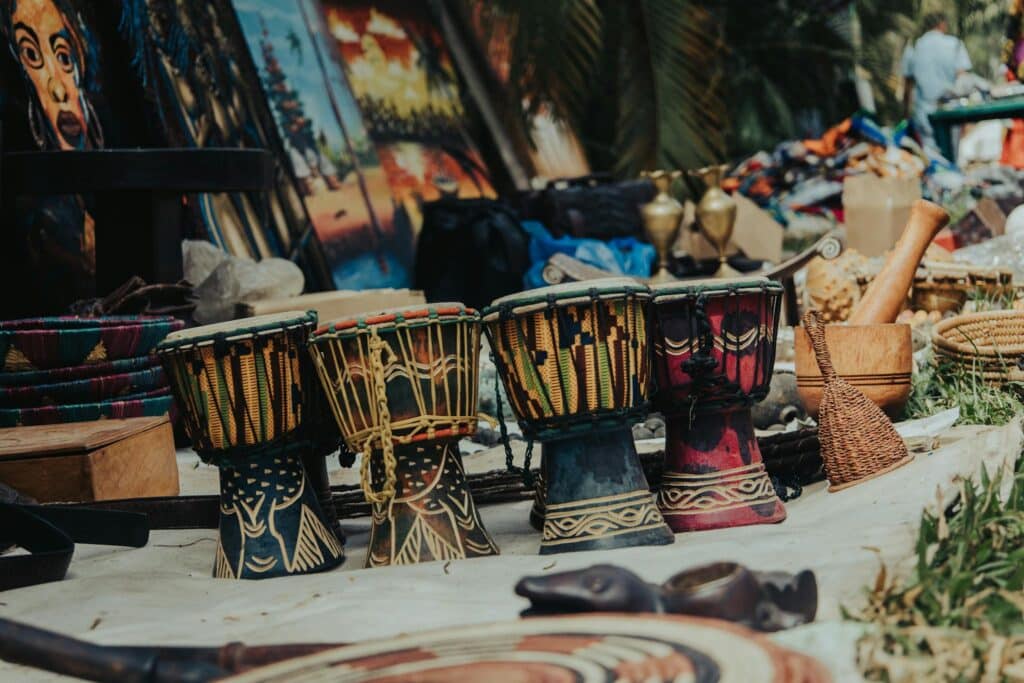 Four drums and other miscellaneous items in a market in Nigeria.