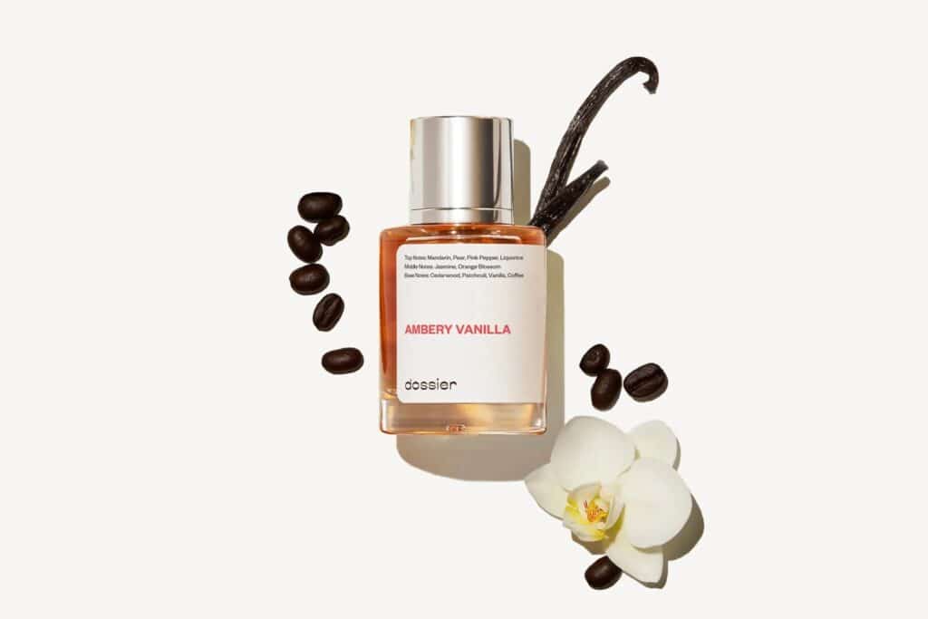 A bottle of Dossier's Ambery Vanilla perfume with decorative vanilla pods around it.